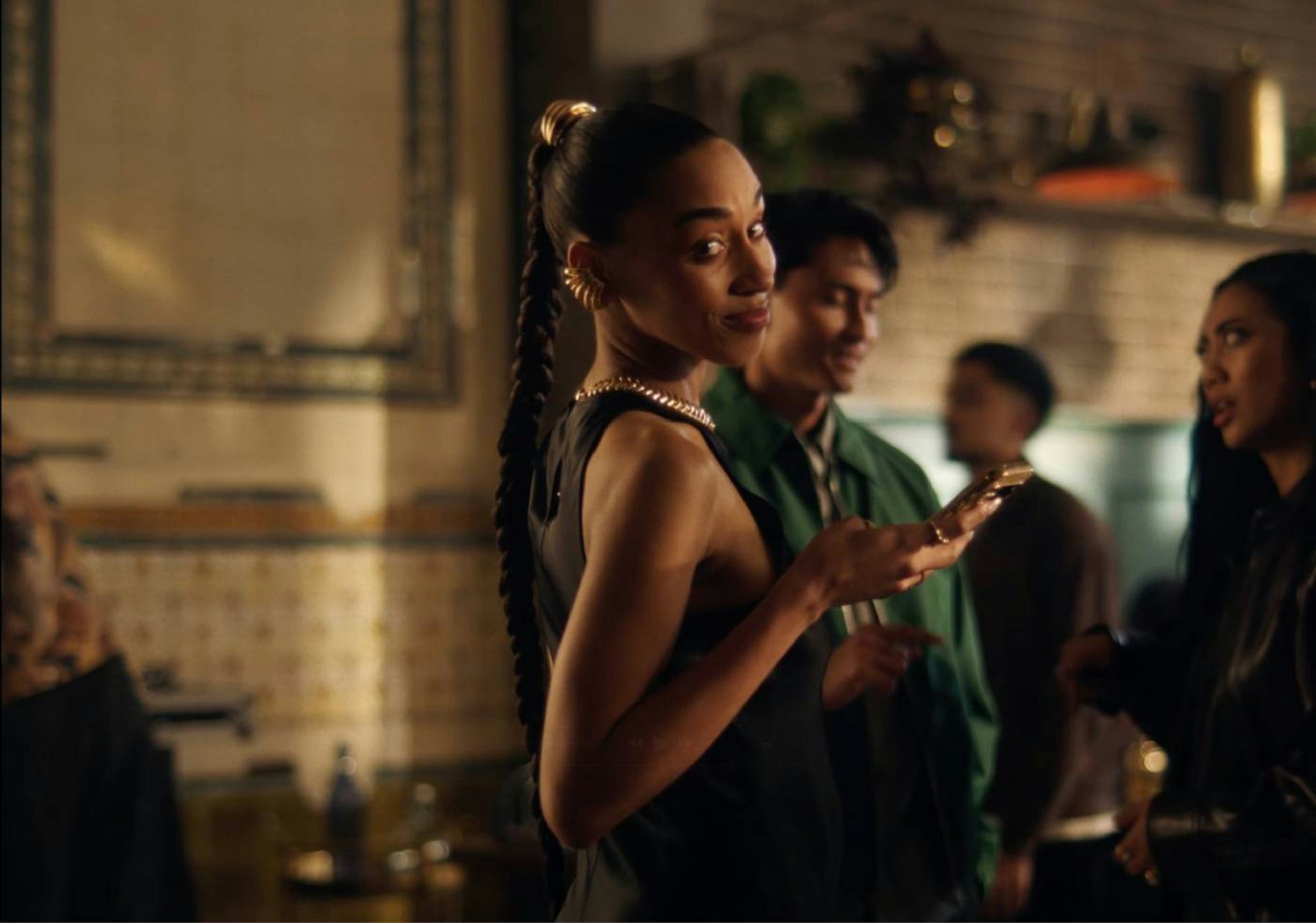 A lady in a social scene smiling