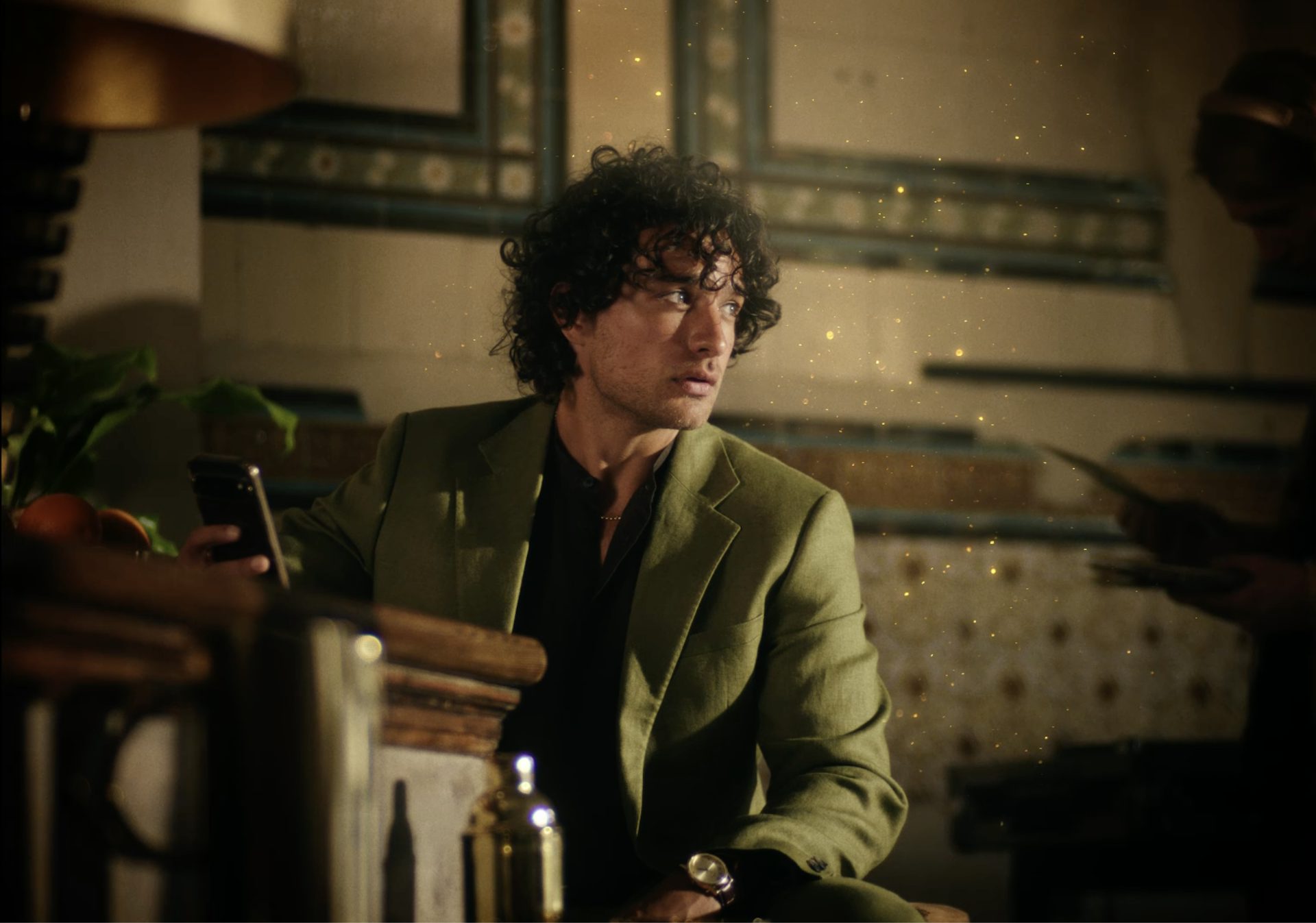 A young man in green coat