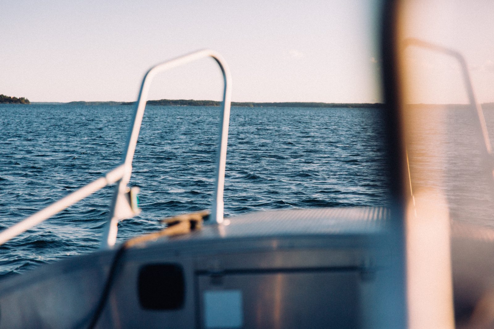 A picture of the sea taken from the front of a boat