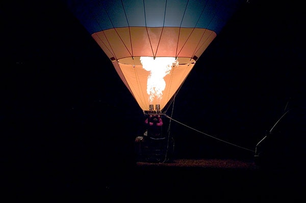 Hot air balloon lit up from inside.