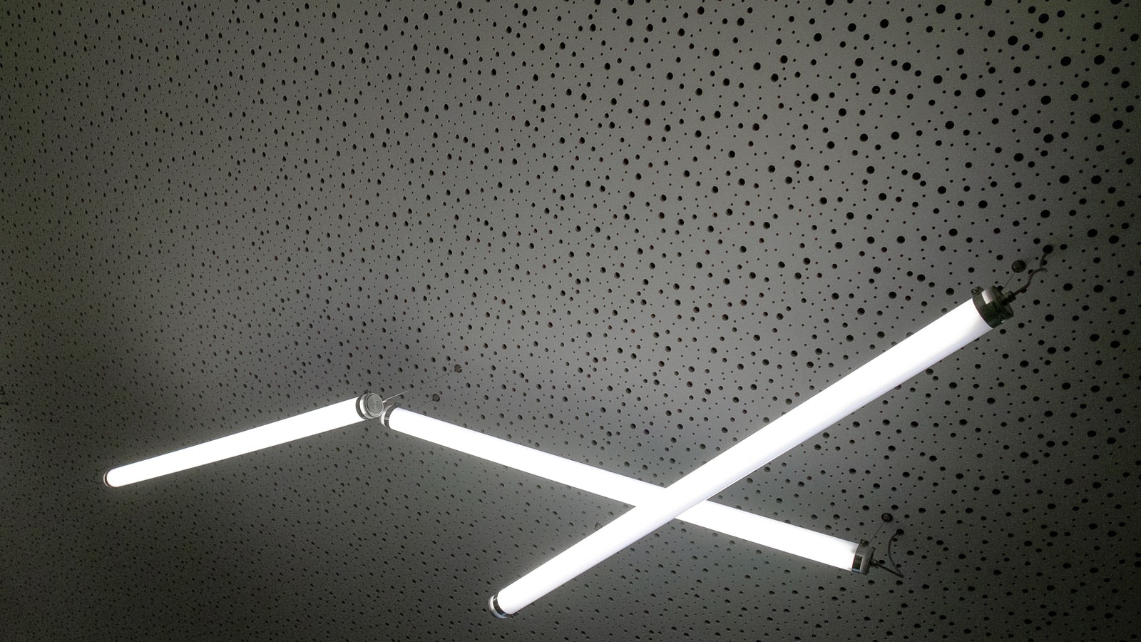 Lit tube light on ceiling.