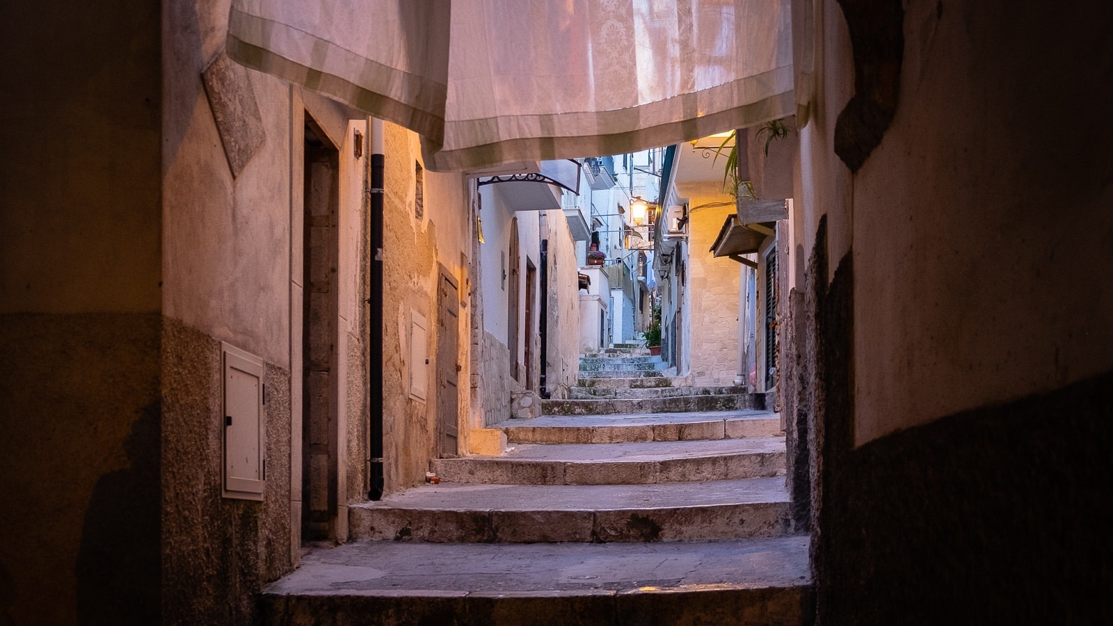 An empty alleyway lined with old stone buildings.