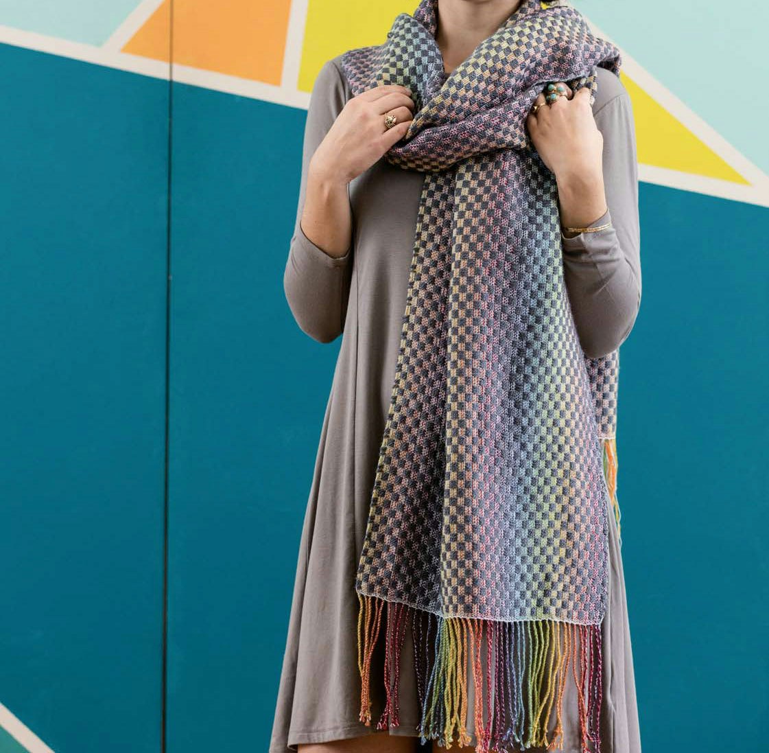 Sara Bixler's Rainbow Connection Shawl from the 2017 Easy Weaving With Little Looms is an example of iridescence creating on a rigid-heddle loom. Photo Credit: George Boe