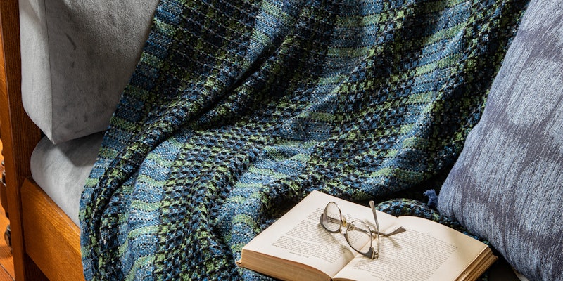 The whole is more than the sum of the parts in this cozy, squishy blanket woven in five panels on a rigid-heddle loom. From Easy Weaving with Little Looms Winter 2022. Photo Credit: Matt Graves
