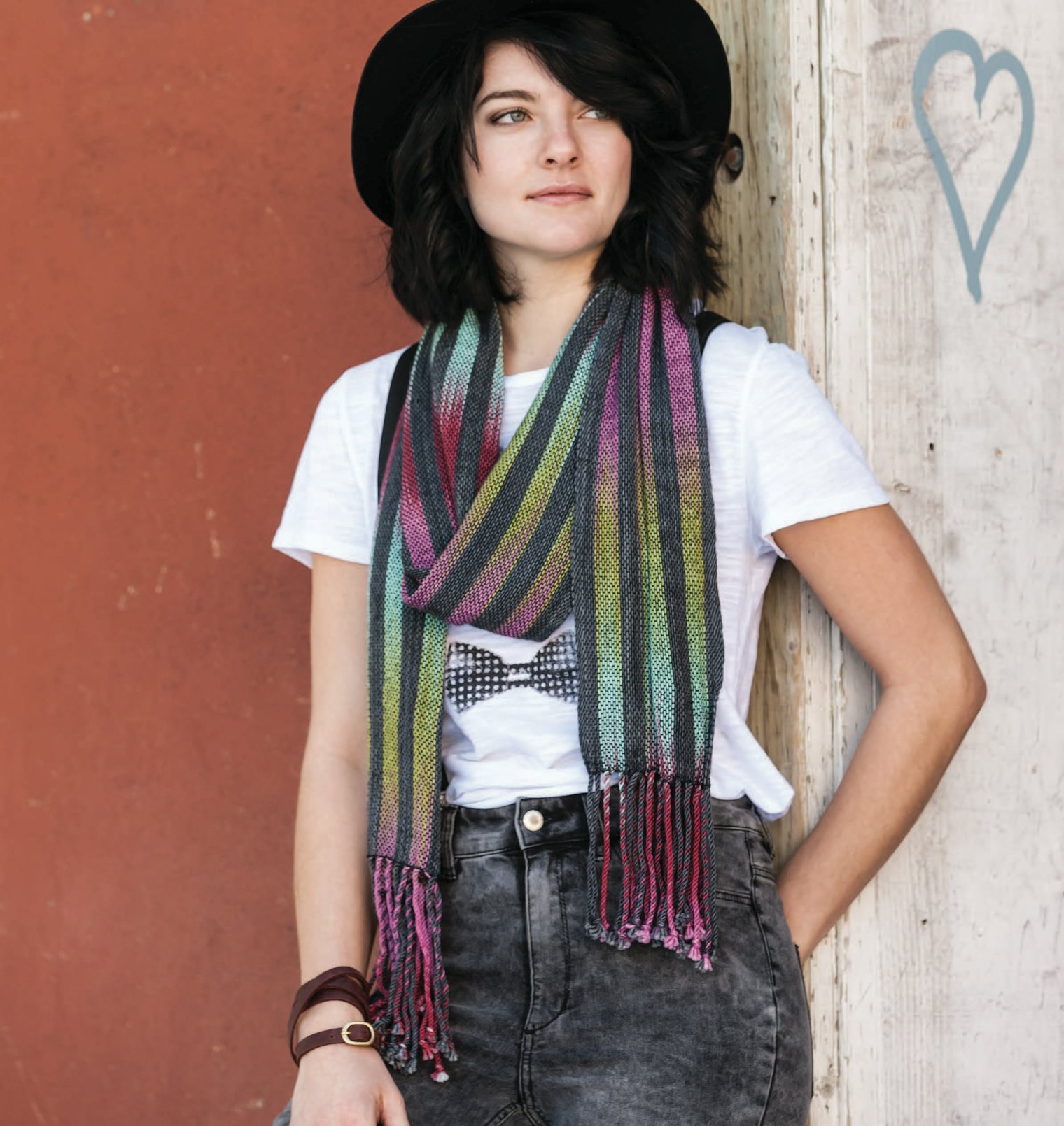 For her Woven Pools Scarf From Summer 2016, designer Gladys We alternating stripes of color pooling with stripes of solid black to great effect. Photo by Joe Coca