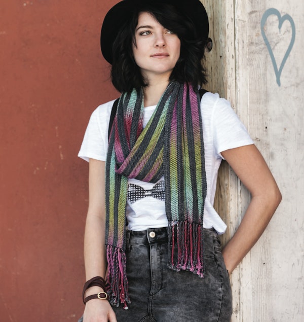 For her Woven Pools Scarf From Summer 2016, designer Gladys We alternating stripes of color pooling with stripes of solid black to great effect. Photo by Joe Coca