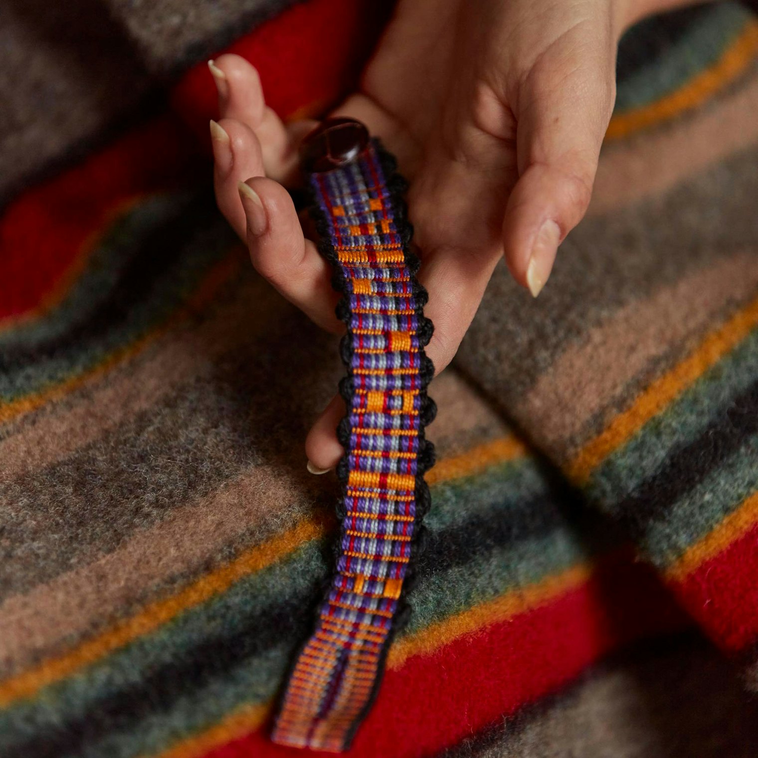 Mountain Sunset Bracelet by Ellen Labruce from the Summer 2019 issue uses assymetrical striping in the warp and textural stripes in the weft. Photo by George Boe