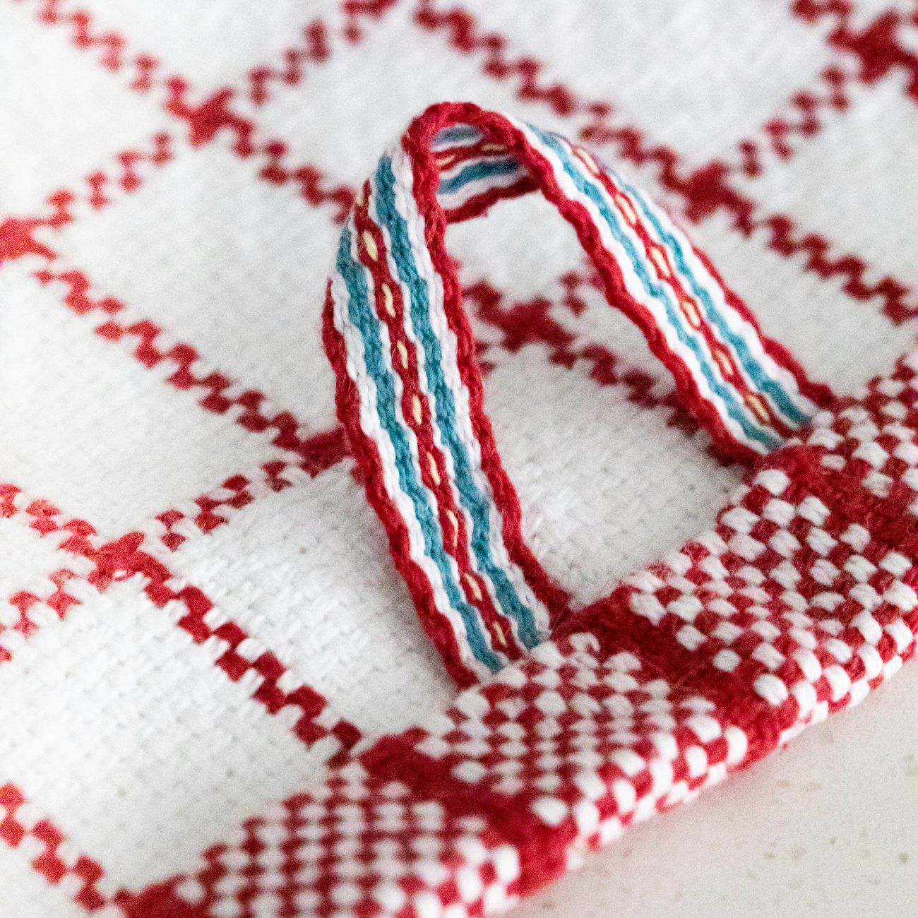 Detail of the inkle-woven tab on Fika Kitchen Towel by Anne Merrow