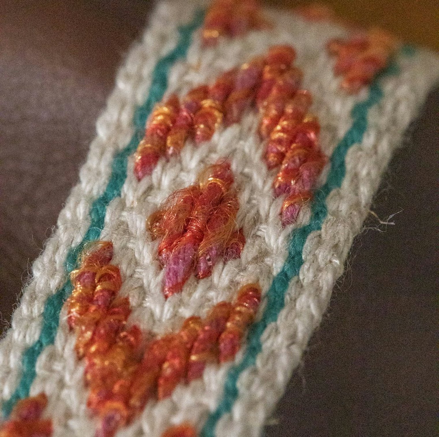 When viewed up close, the metallic strands in the pattern warp are more obvious.
