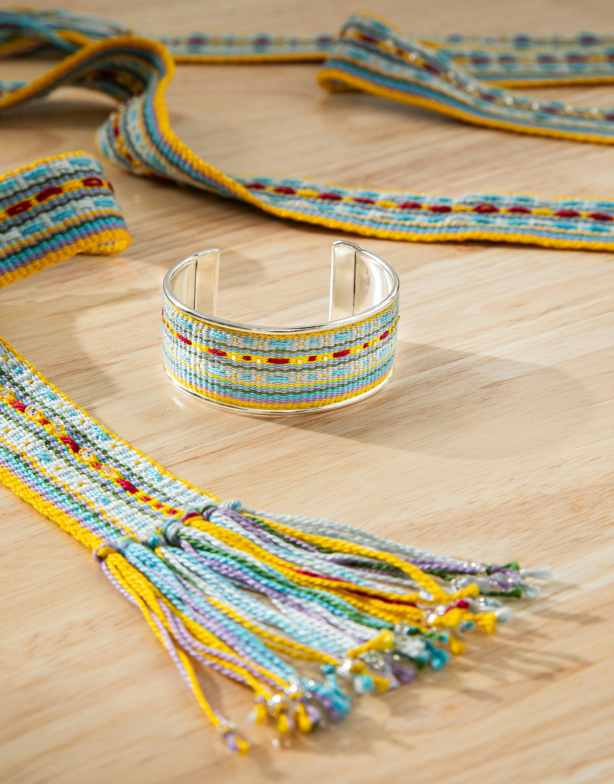 Inspired by traditional handfasting bands, Jennifer B. Williams’ Something Blue Bouquet Band will turn even the simplest collection of flowers into something truly spectacular. Weave the coordinating bracelet for members of the wedding party or as a memento of your special day.