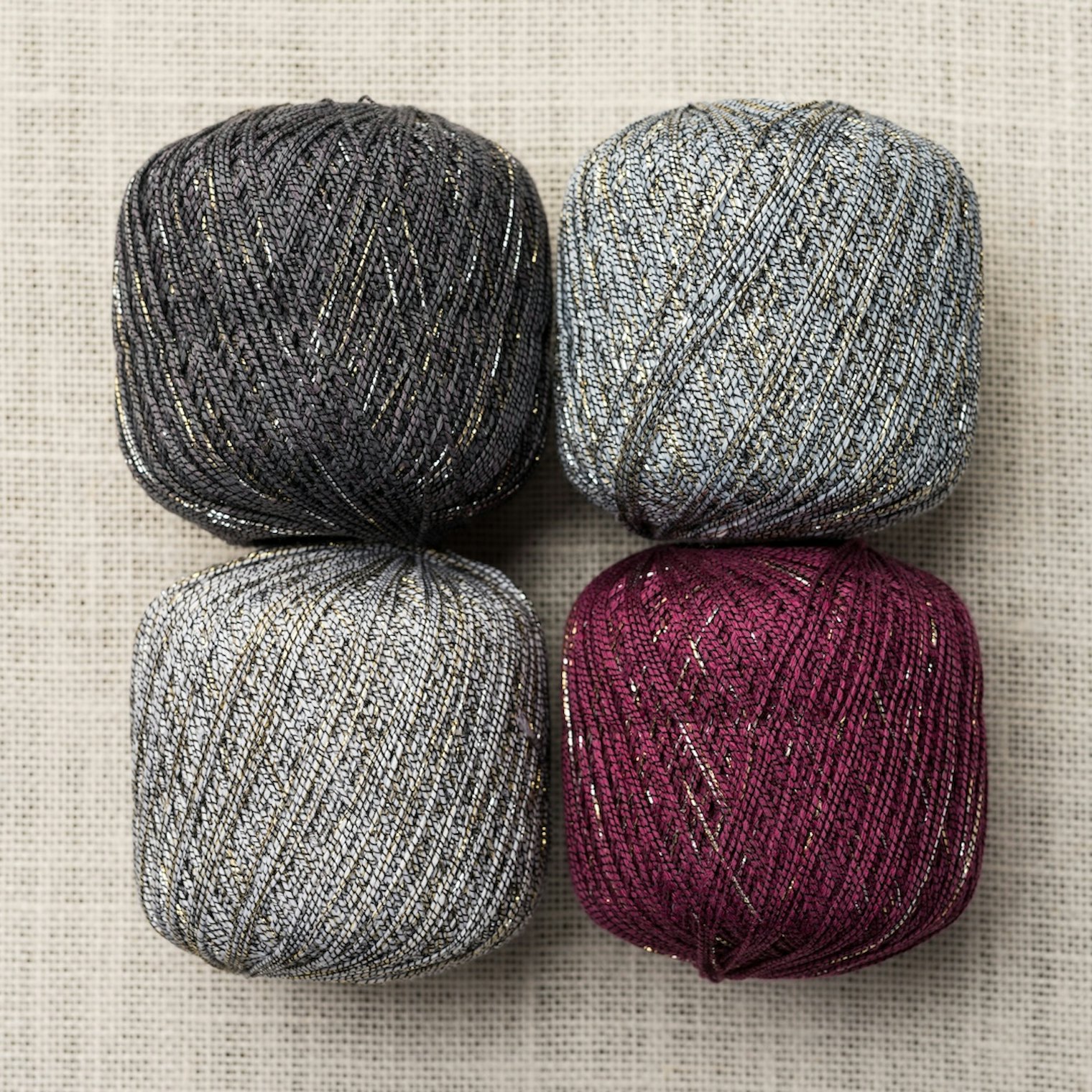 Put-ups of the yarn Amy used. Notice that only a small part of the yarn's total surface area is metallic.