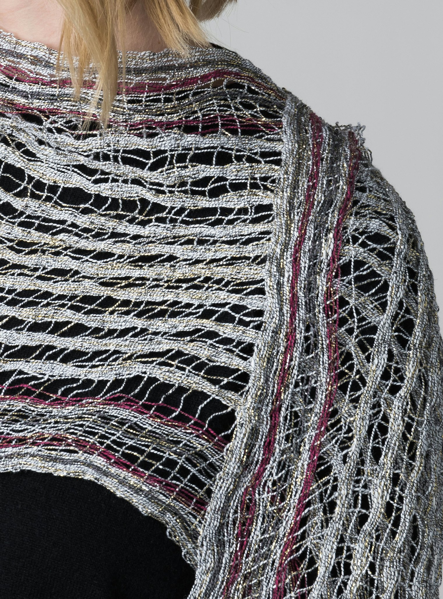 The finished scarf woven entirely from metallic yarn.