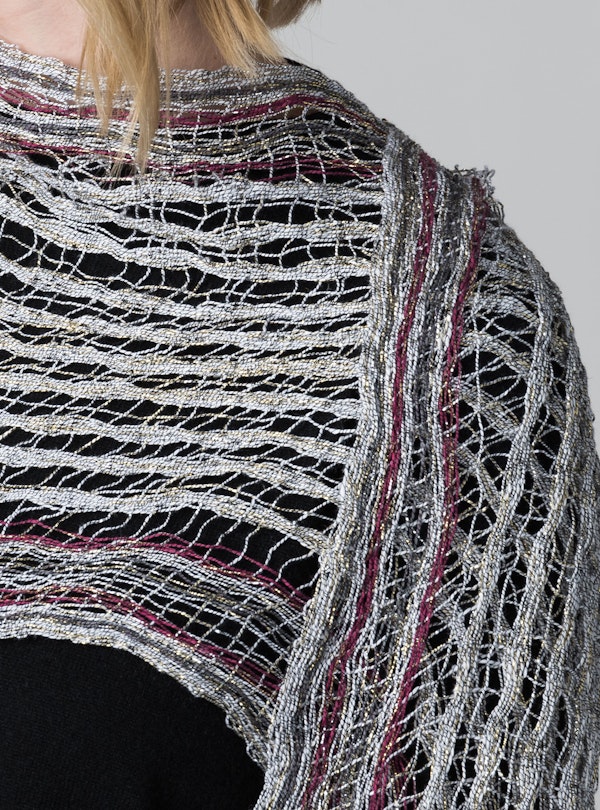 The finished scarf woven entirely from metallic yarn.