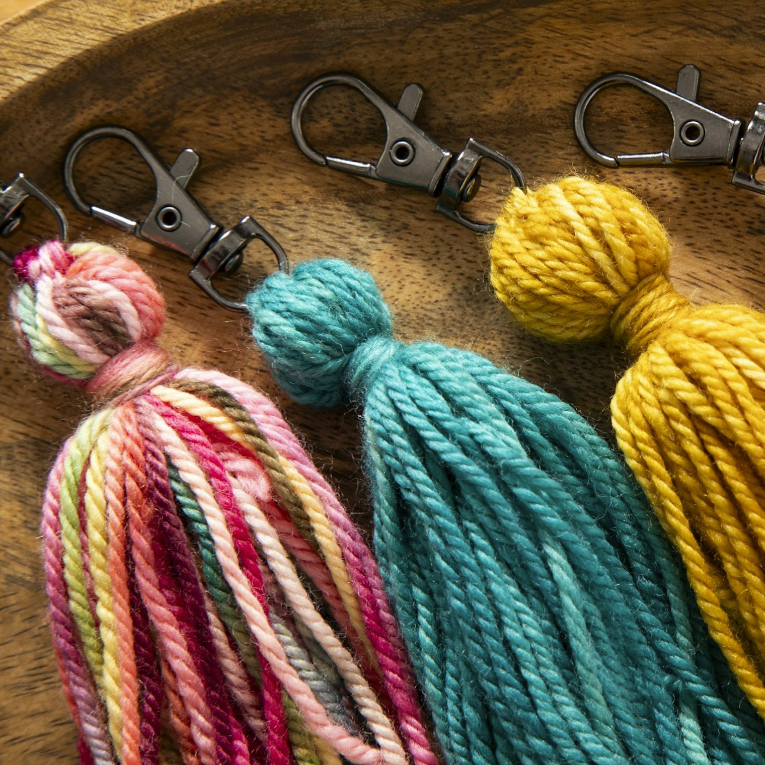 Close up of some of the tassels Gabi made using the small amounts of yarn leftover from her scarf project.