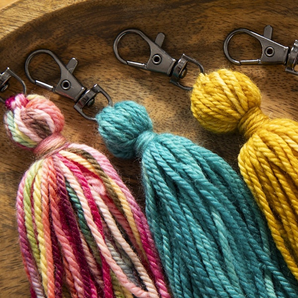 Close up of some of the tassels Gabi made using the small amounts of yarn leftover from her scarf project.