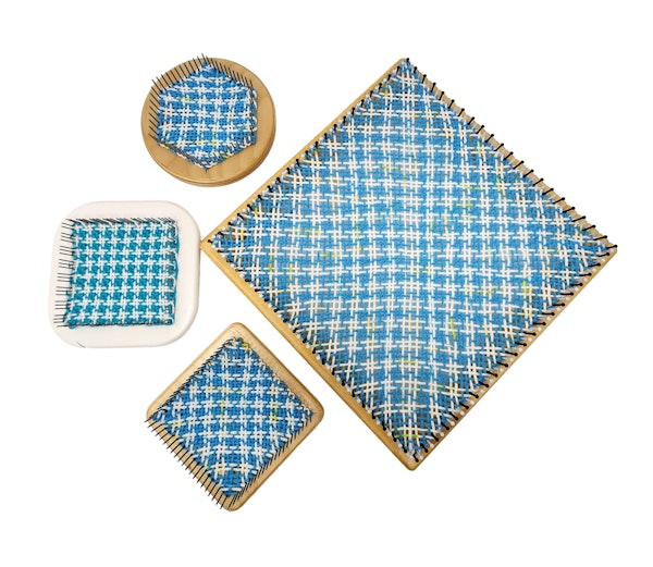 There are several shapes and types of looms shown here, including a 3-pin-style square and a hexagon loom. Photo by Gabi van Tassell