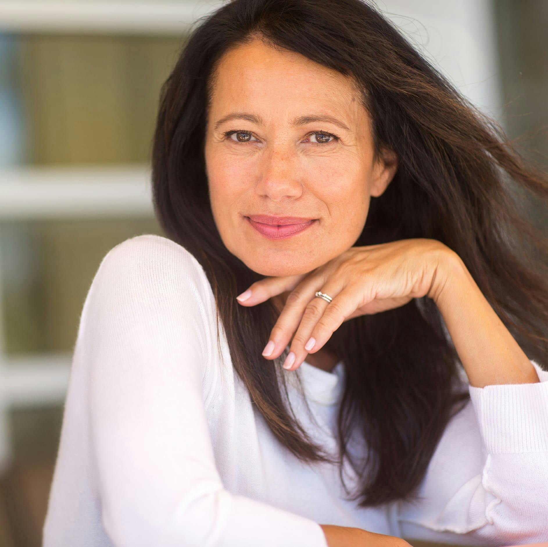 woman with brown long hair smiling