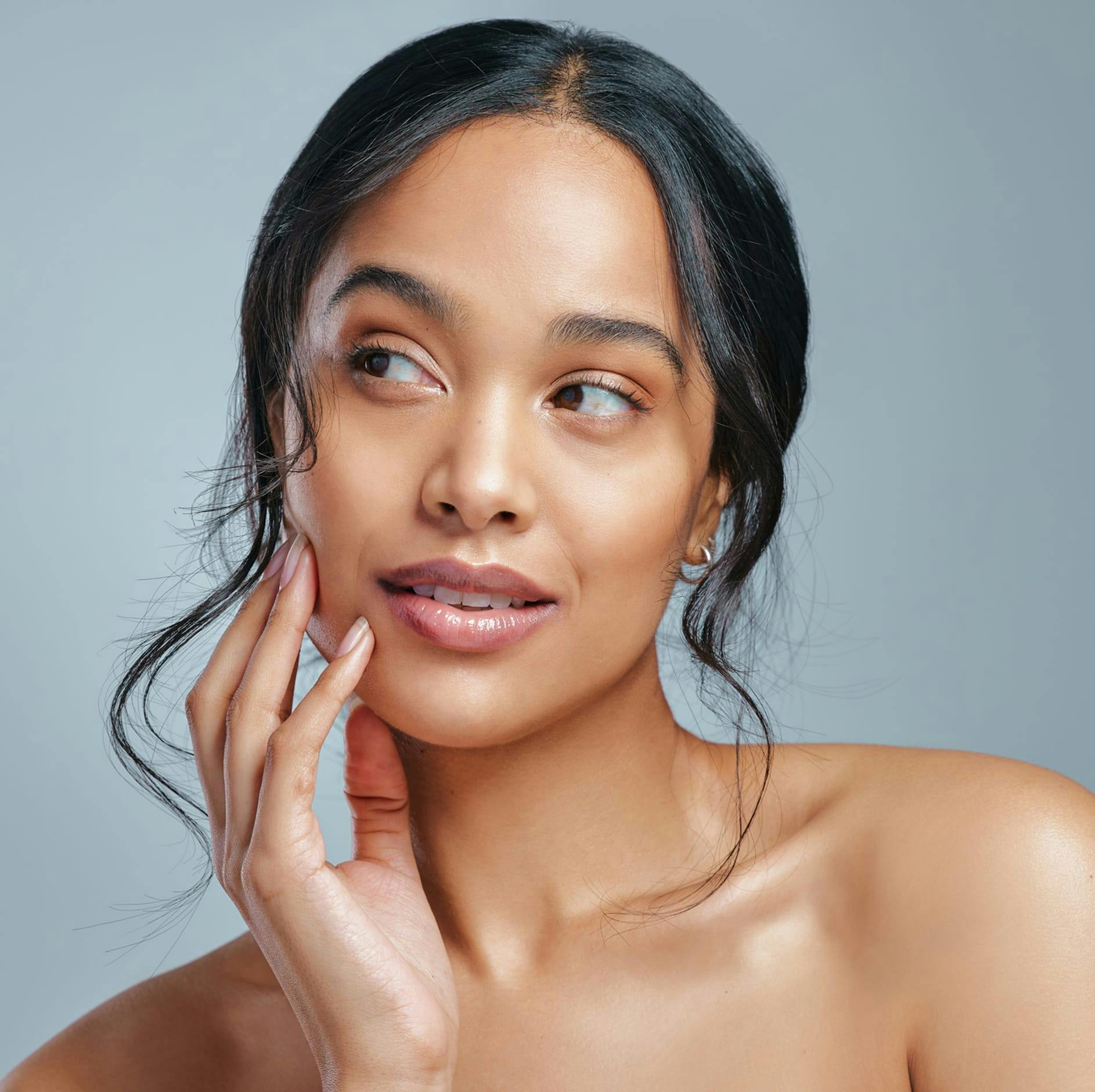 woman with black hair and looking to the side