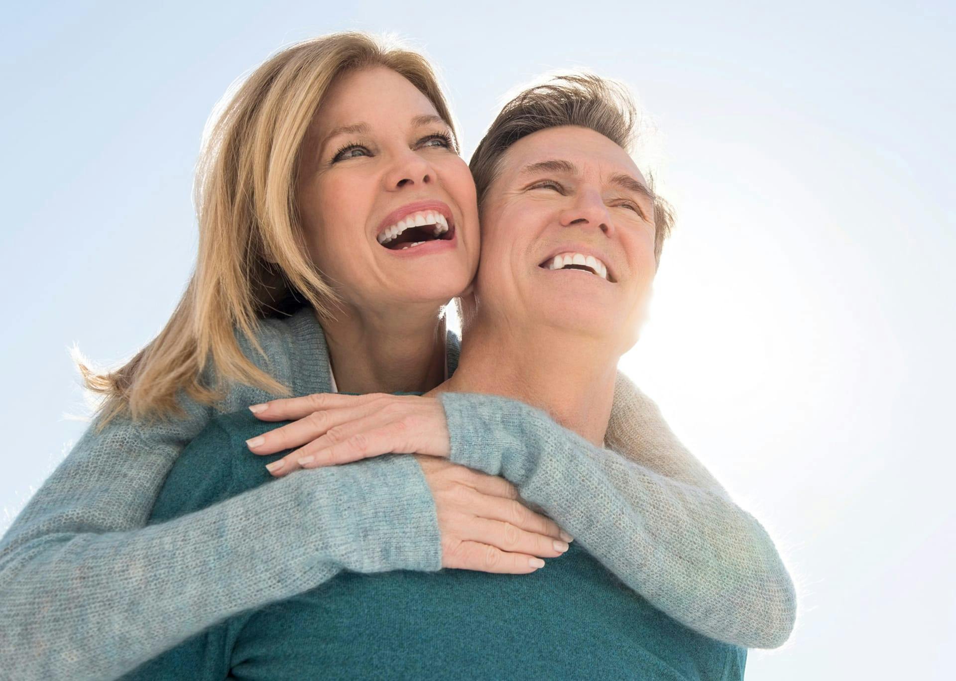 woman hugging a man smiling