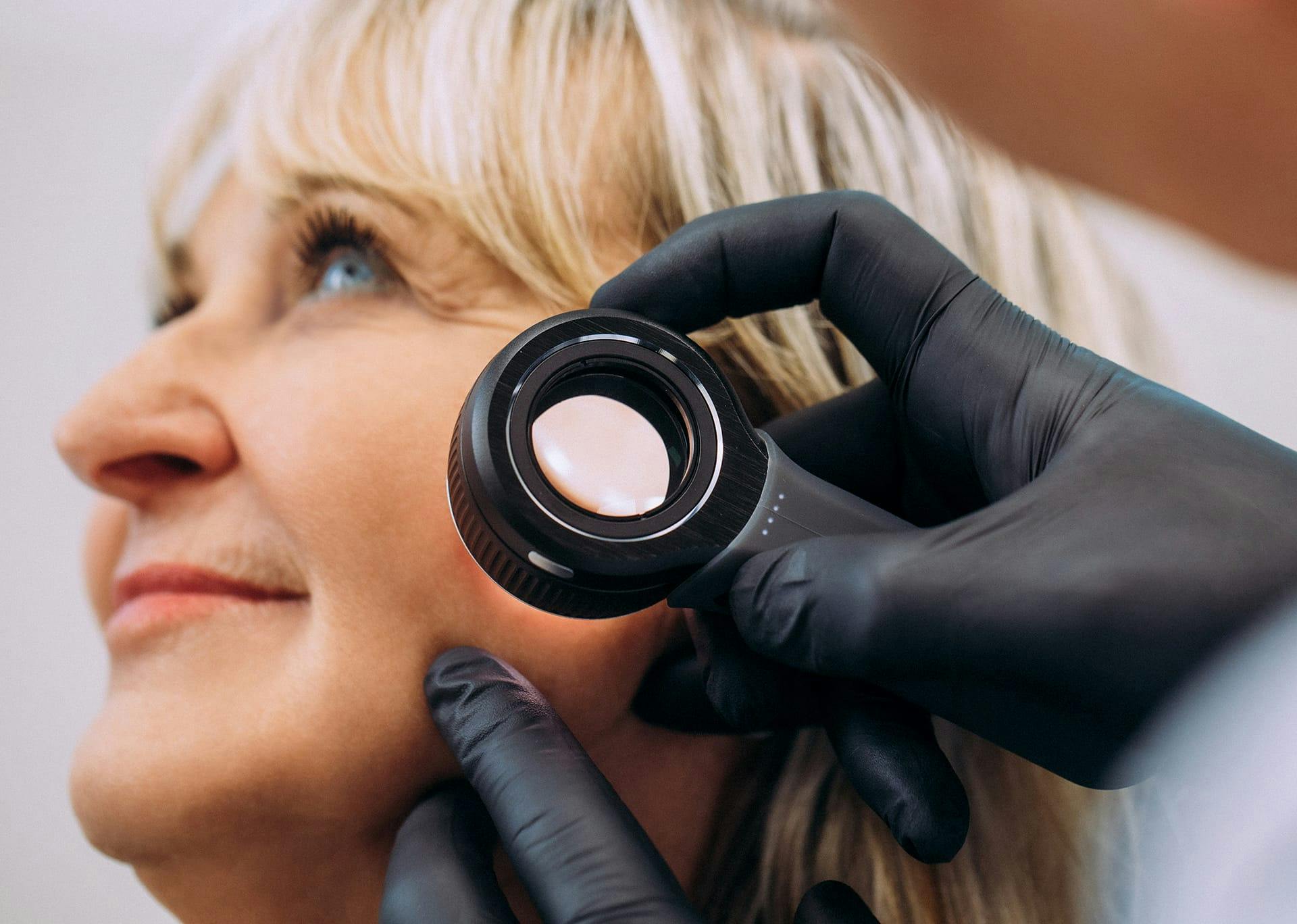 a close up of a microscope on a woman's face