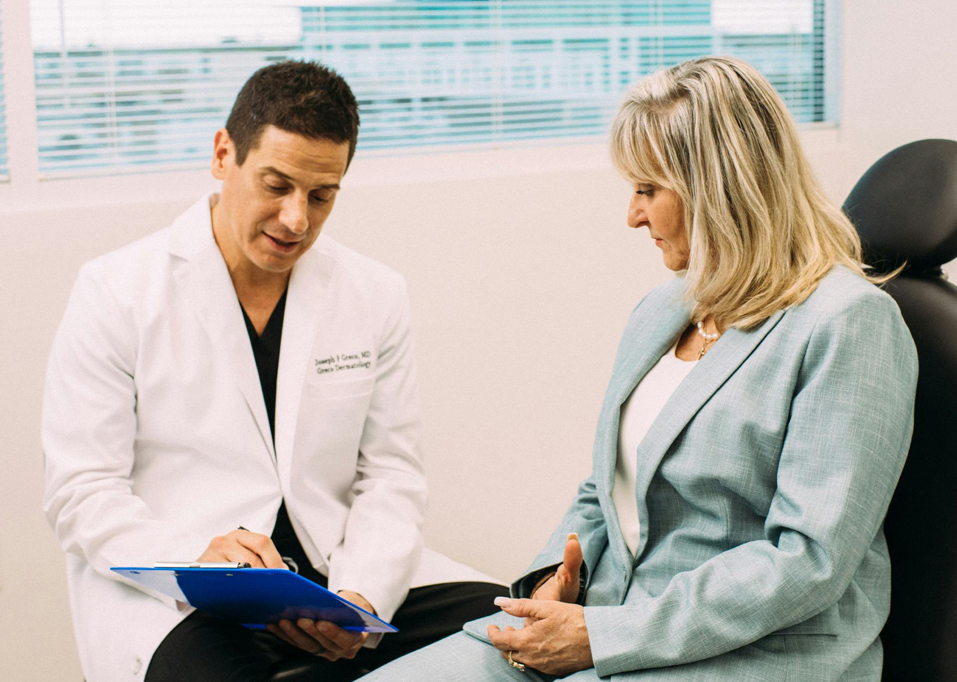Dr. Greco talking to a patient