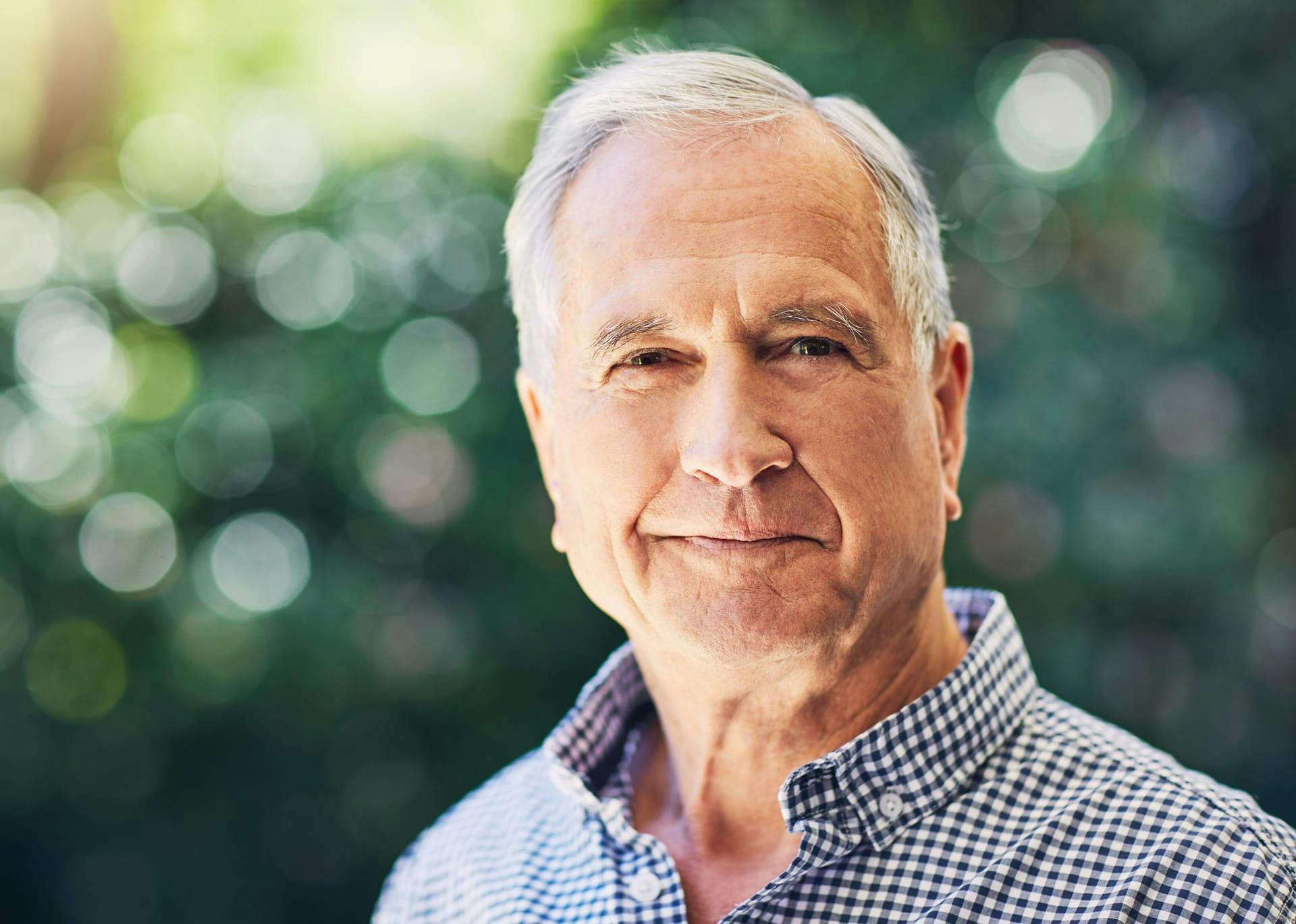 older man smiling at the camera