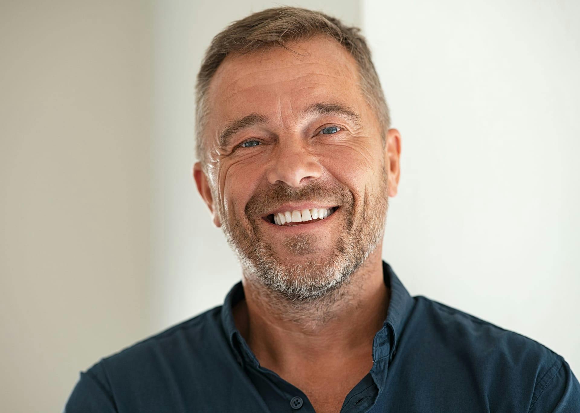 man with a beard smiling
