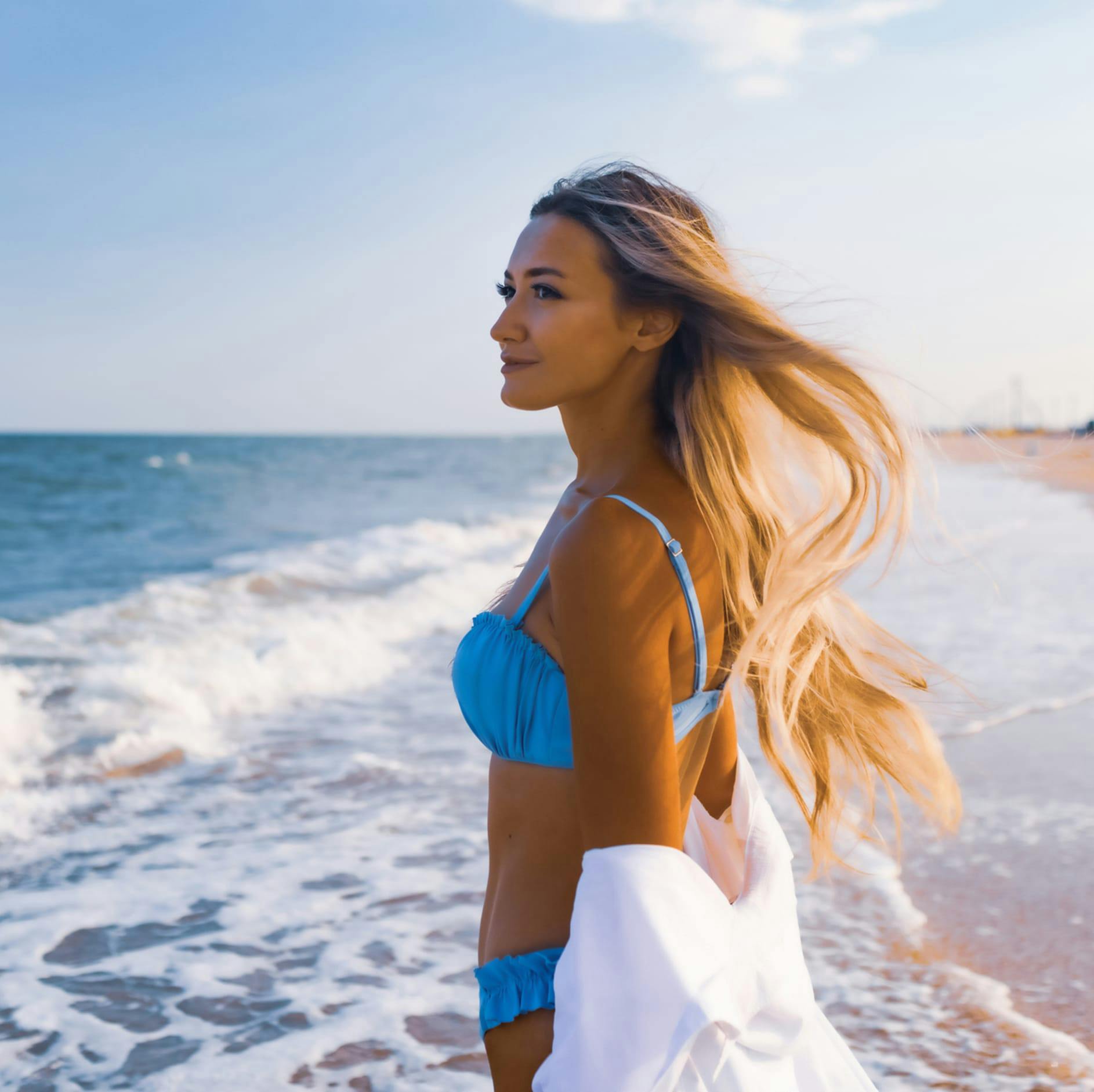 woman in a blue bikini at the beach