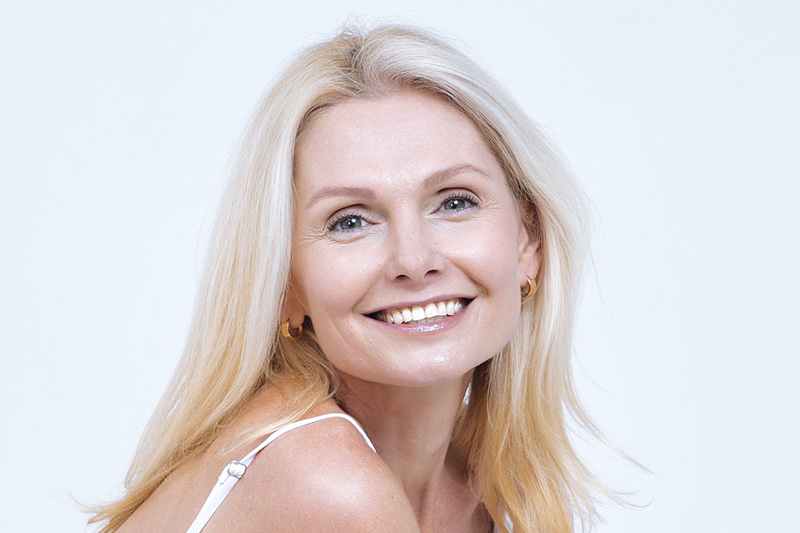 older woman smiling at the camera