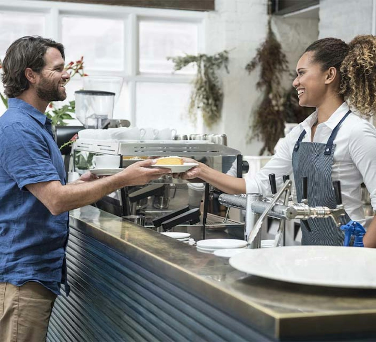 Hospitality worker serving food to customer