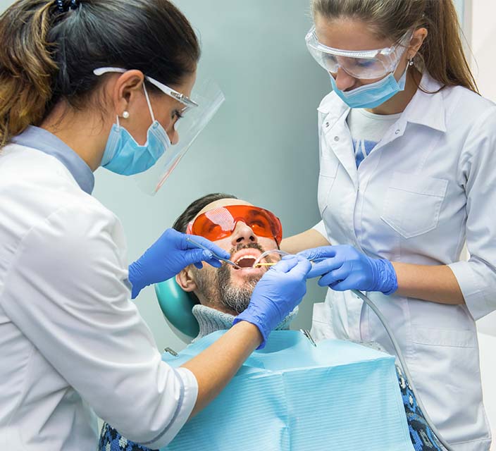 Dental Assistant helping with a procedure