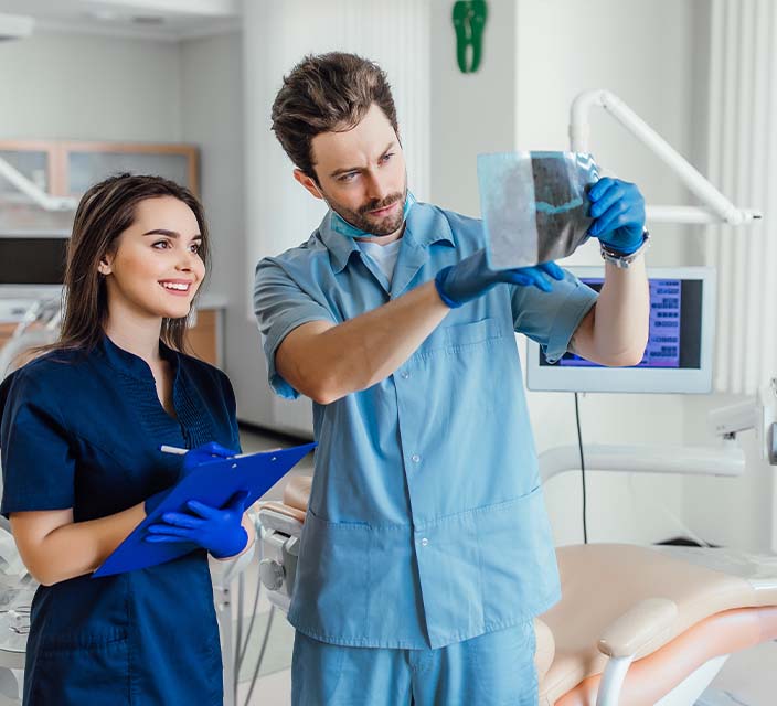 Dental Assistant working with Dentist