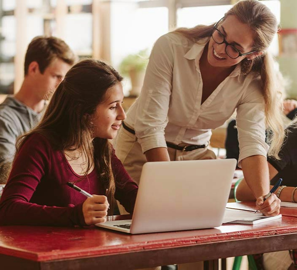 Teacher Aide with high school student