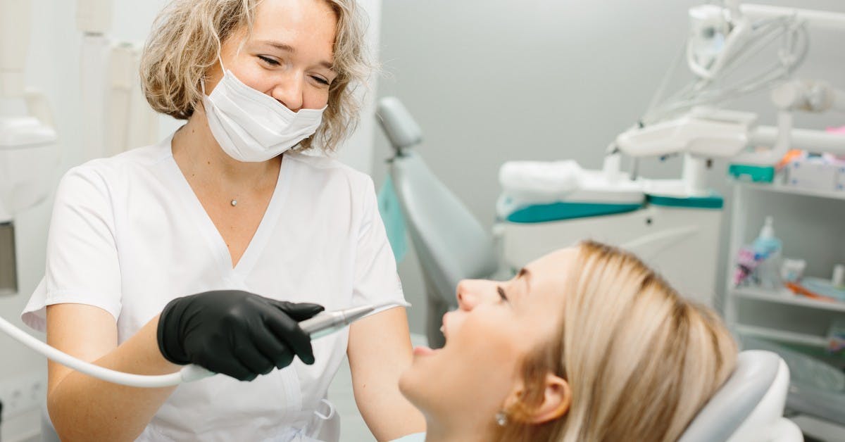 dental assistant and patient