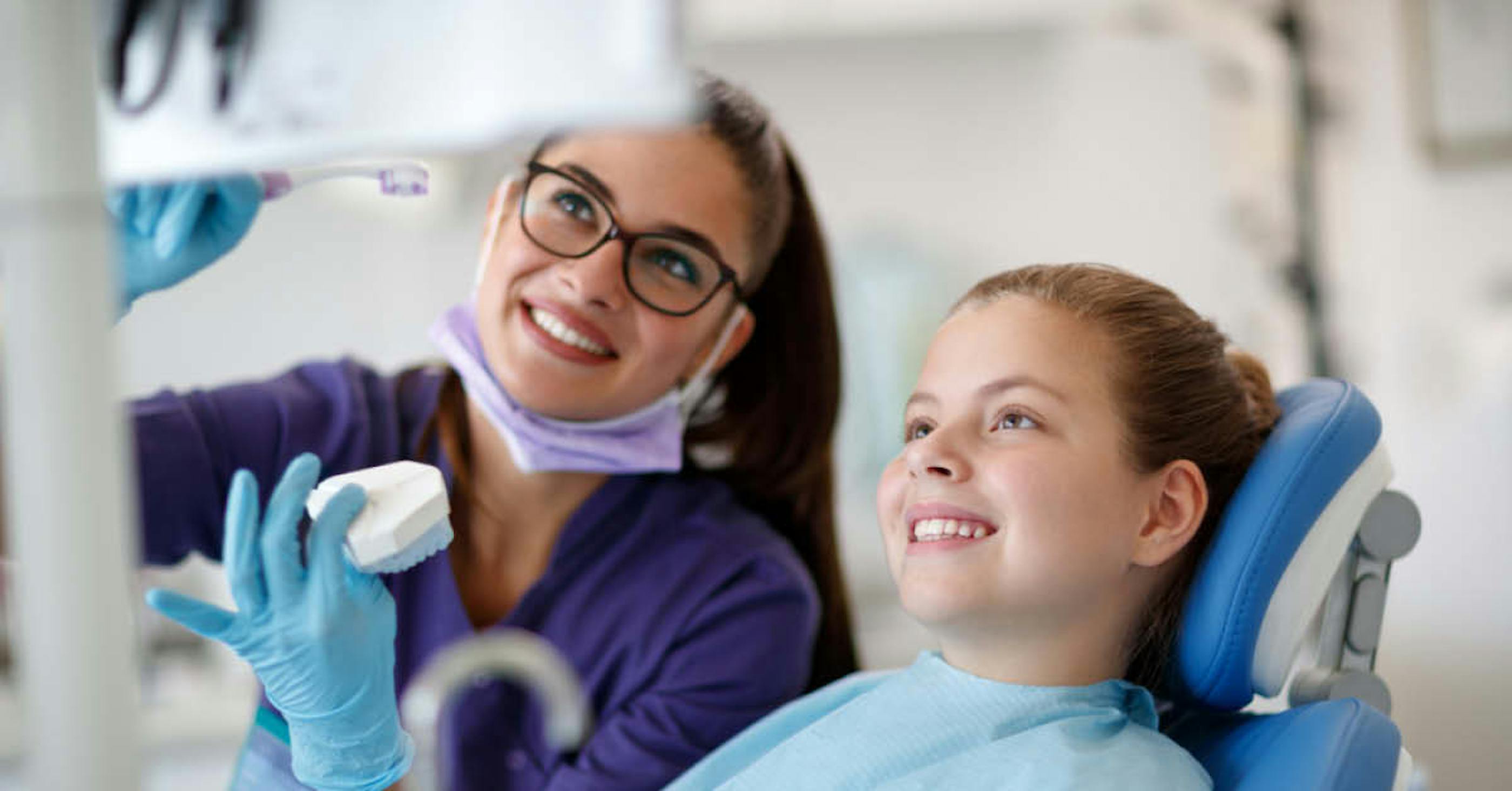 Dental Hygienist with Young Patient - Foundation Education