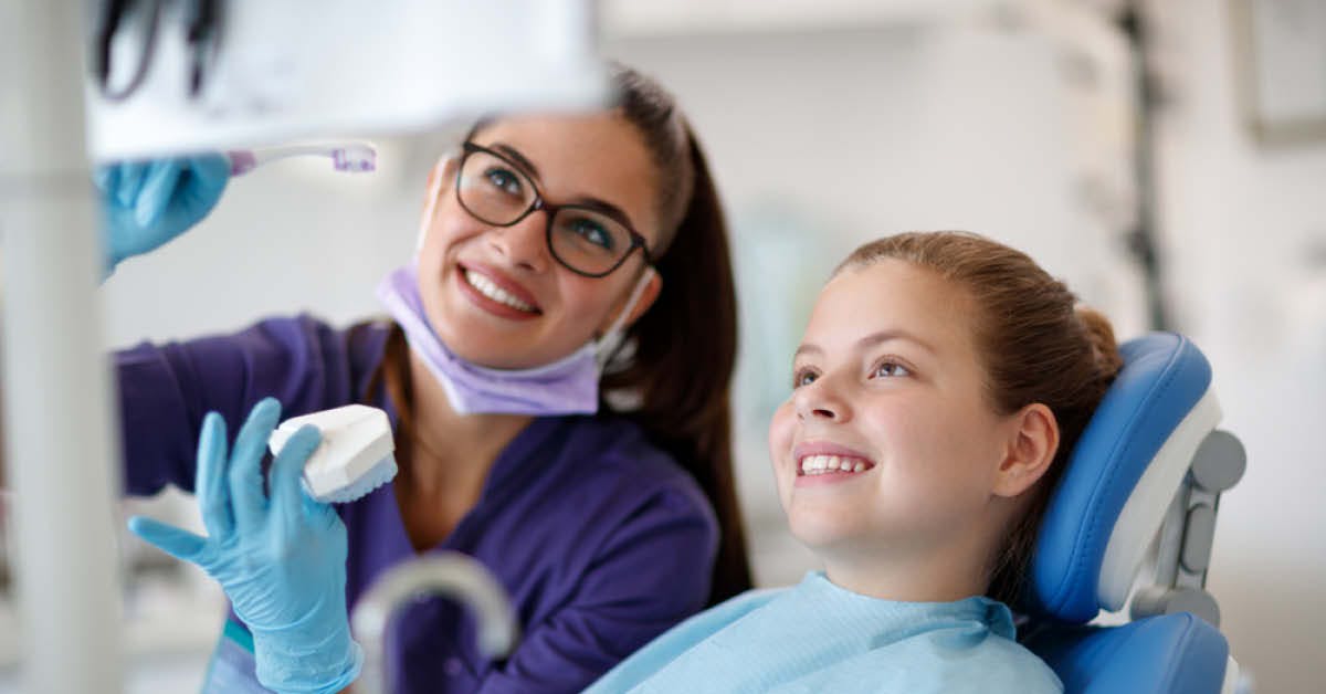 Dental Hygienist with Young Patient - Foundation Education