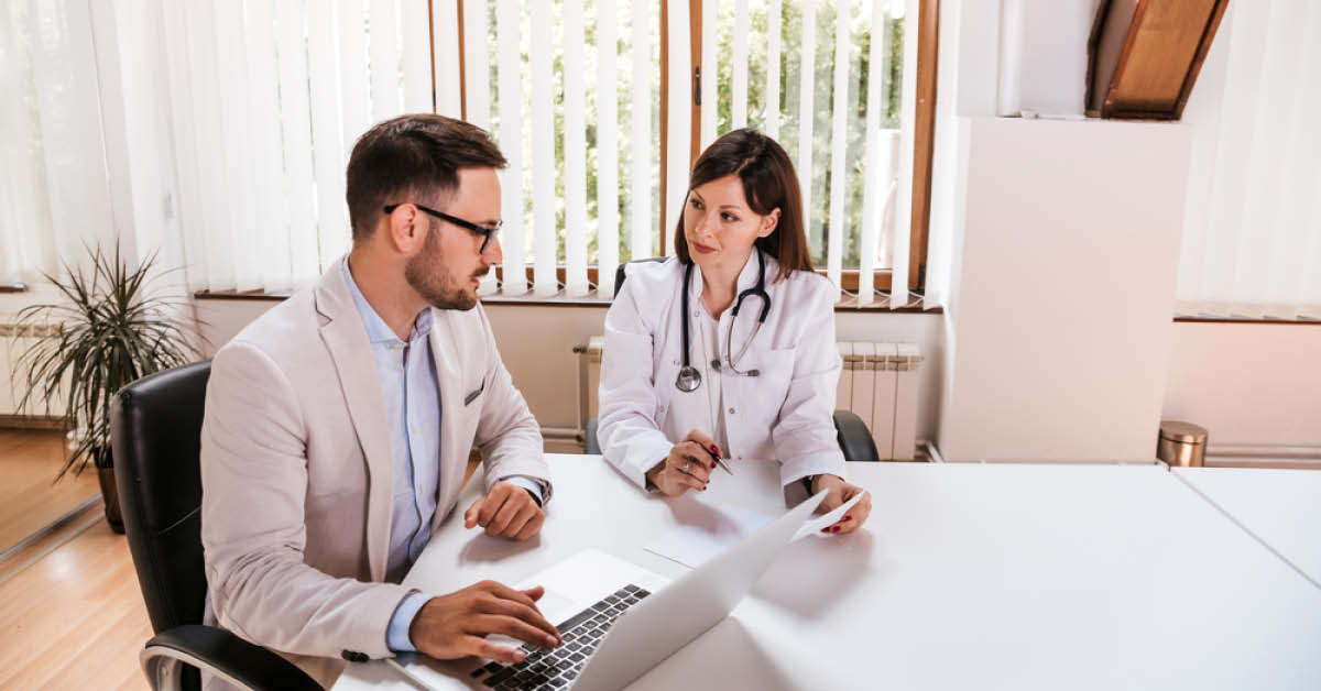 Hospital Manager Speaking with Doctor - Foundation Education