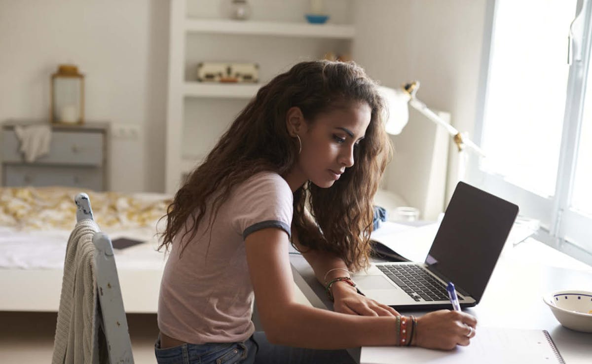 Women study at home desk