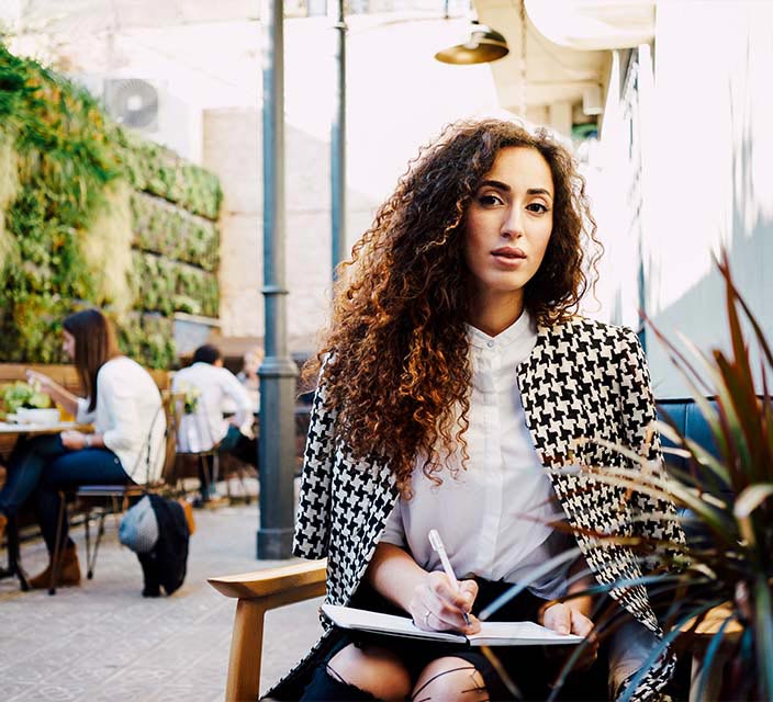 Female worker in coffee shop, working. 