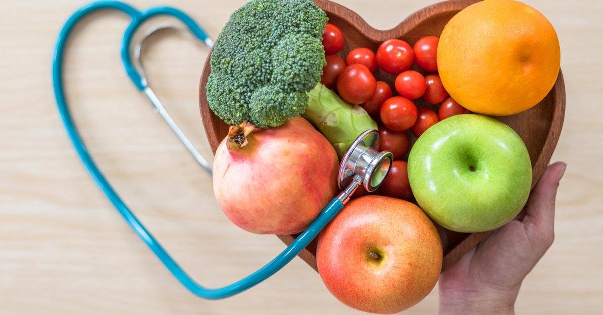 Fruit and vegetables in heart shaped bowl