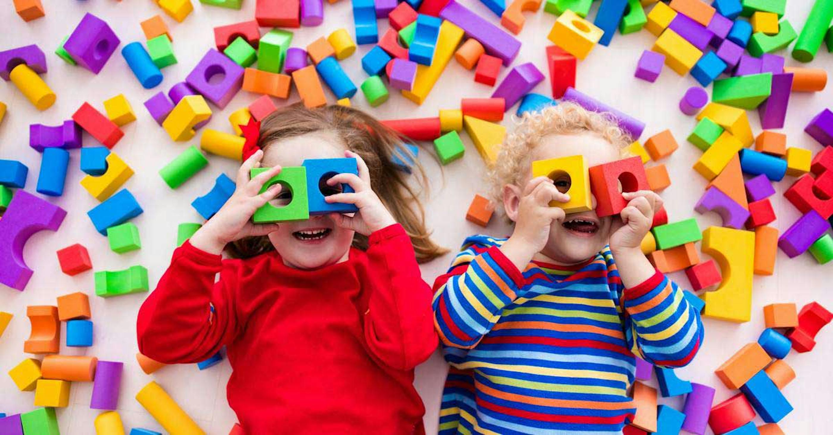 Students with ADHD playing amongst colourful blocks