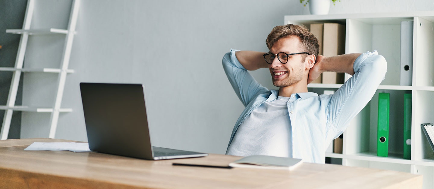 Happy man using laptop