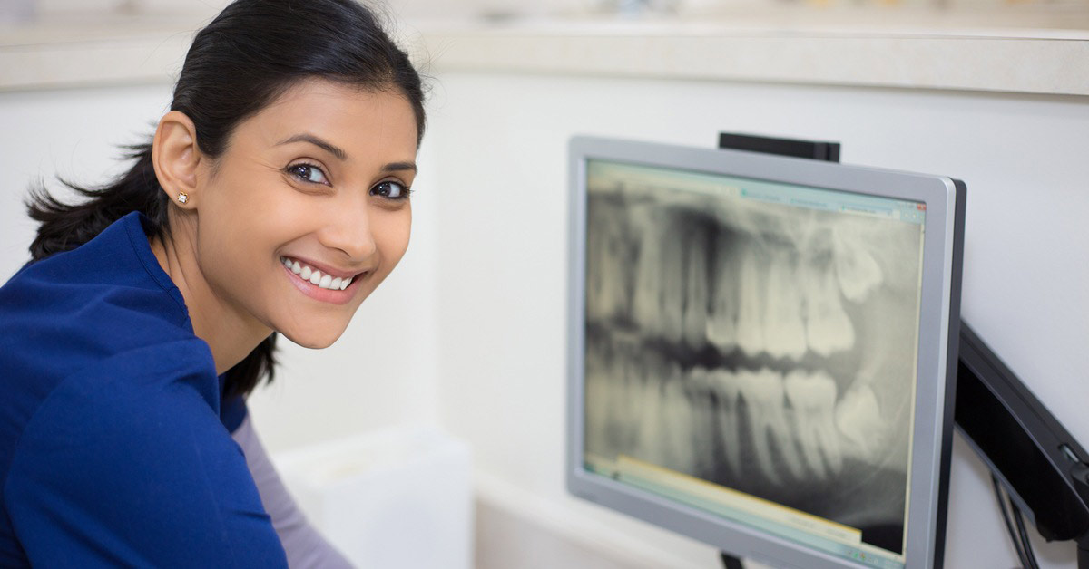 Allied Health Assistant looking at mouth scans