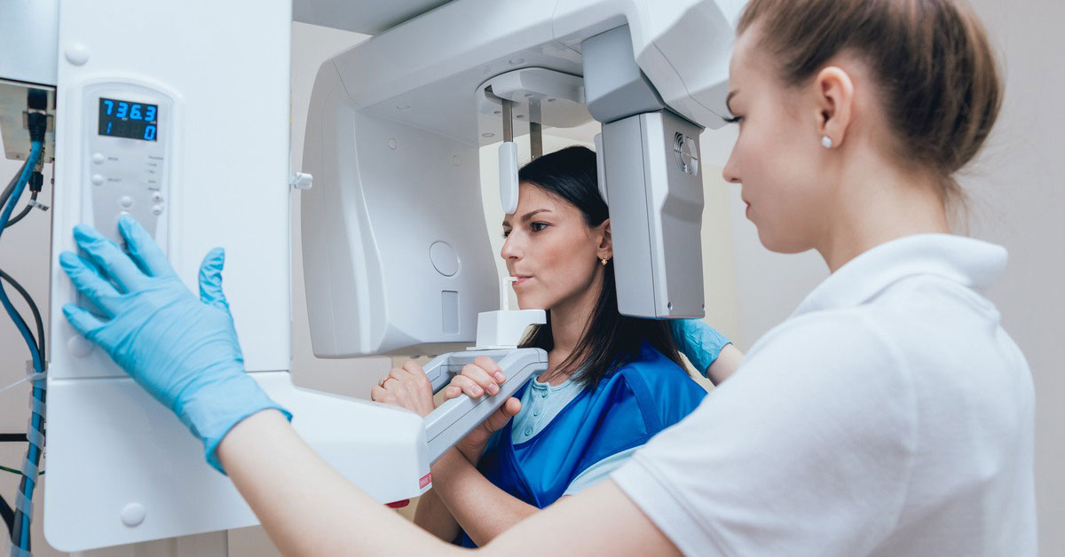 Nurse performing a dentist x-ray