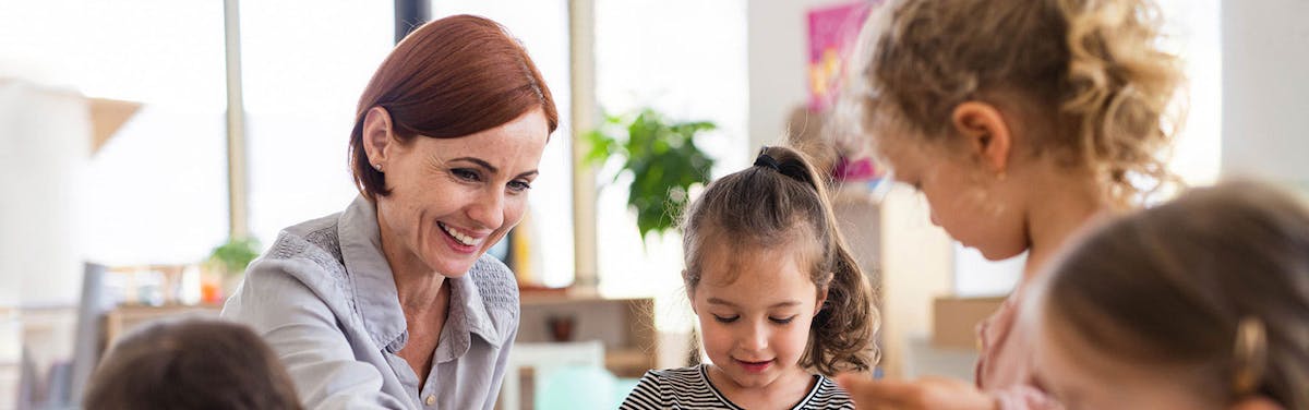 Photo of Woman caring for toddlers