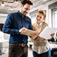 Man and woman looking at paperwork