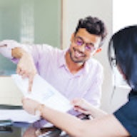 Man and woman looking at paperwork