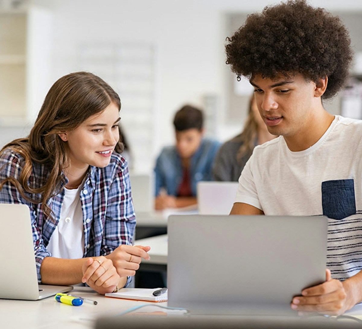 School kids using laptop