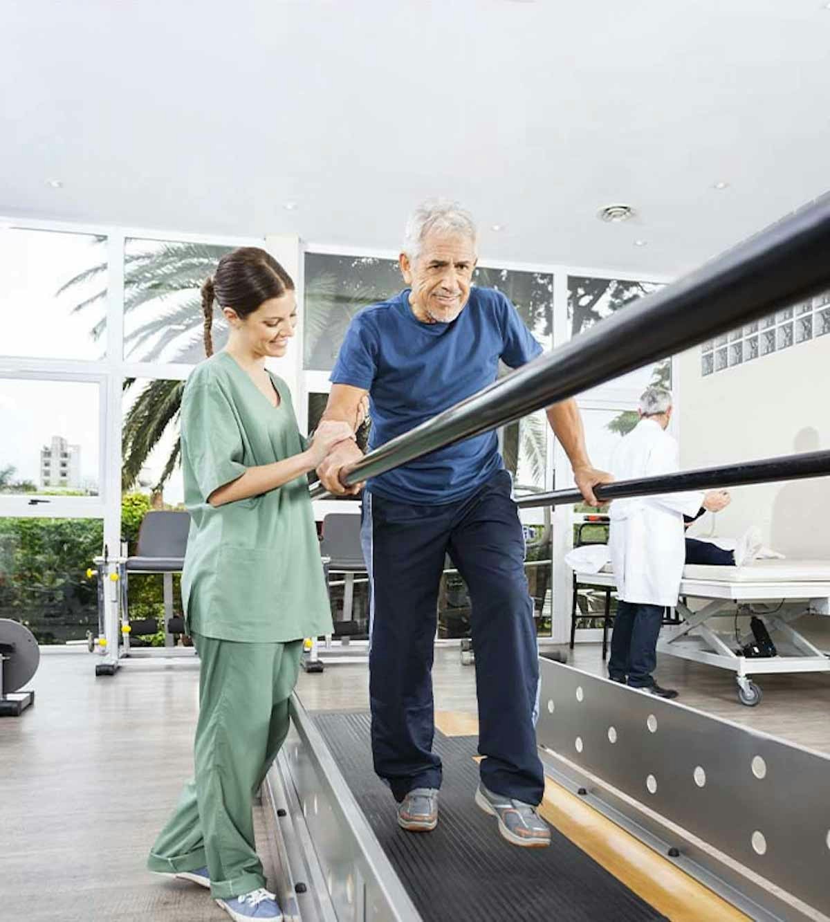 Woman assisting elderly man