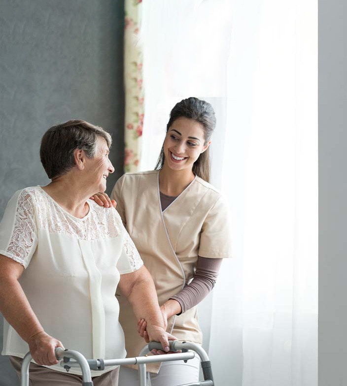 Woman helping elderly lady